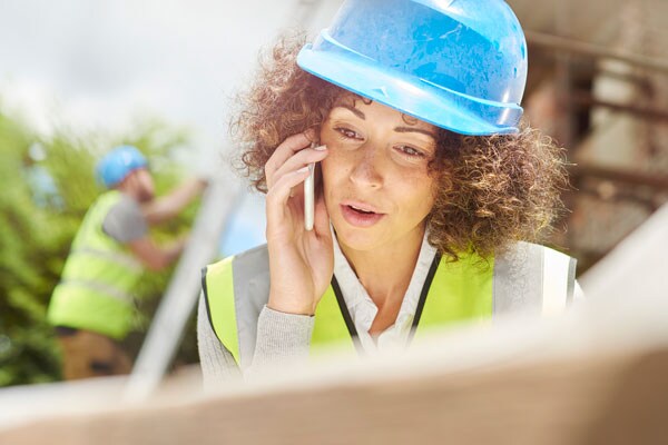 Construction Worker Speaking on the Phone