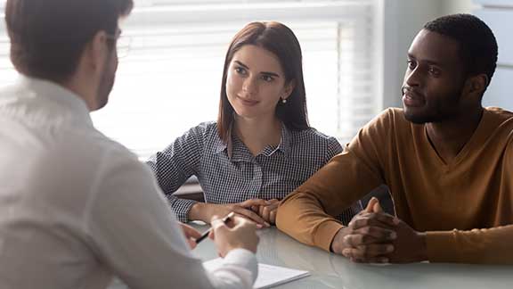 Couple Talking to a Dealer