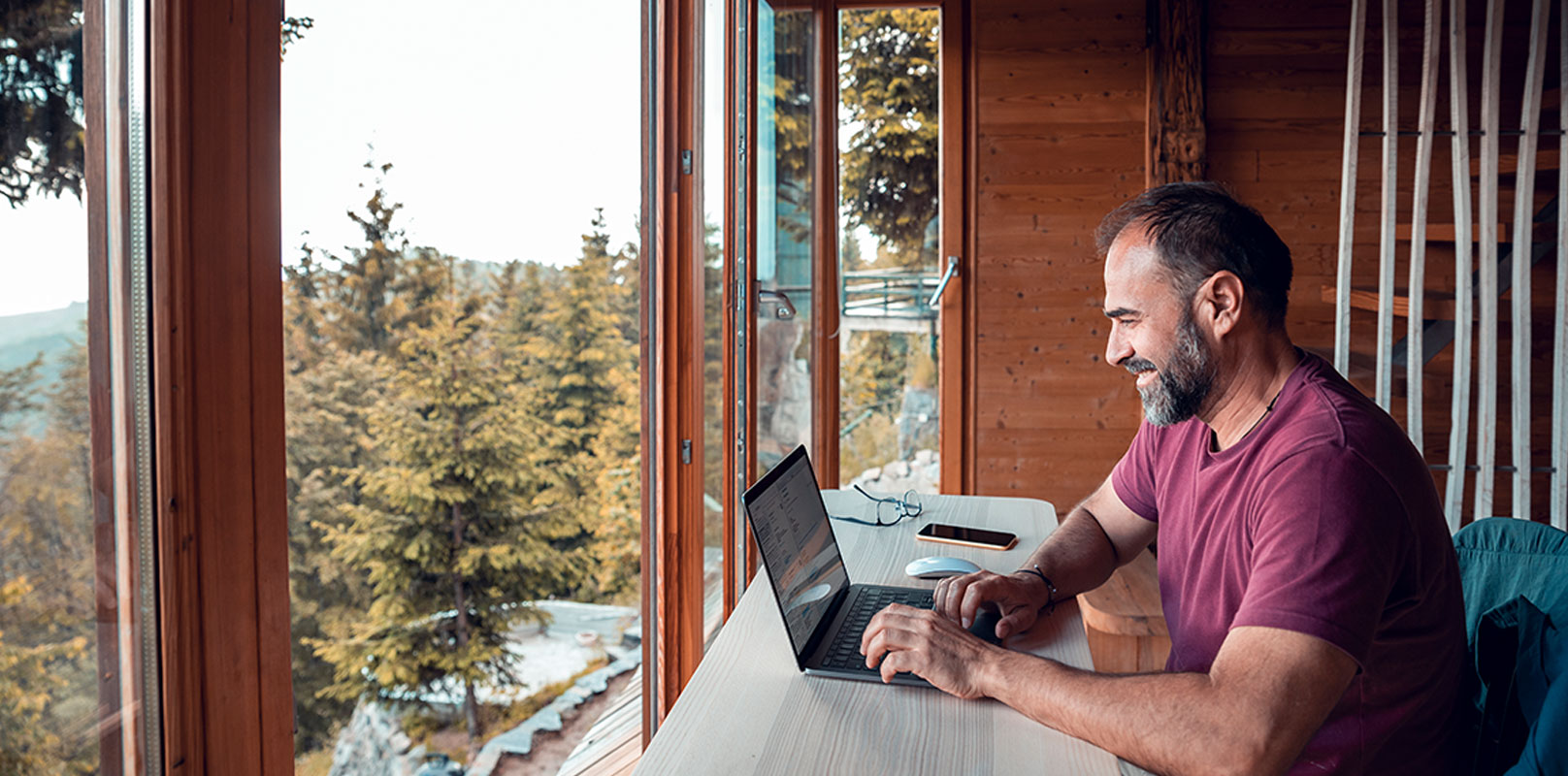 A man working on his laptop at a desk